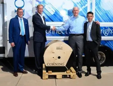 male construction worker on his phone while looking at a notepad