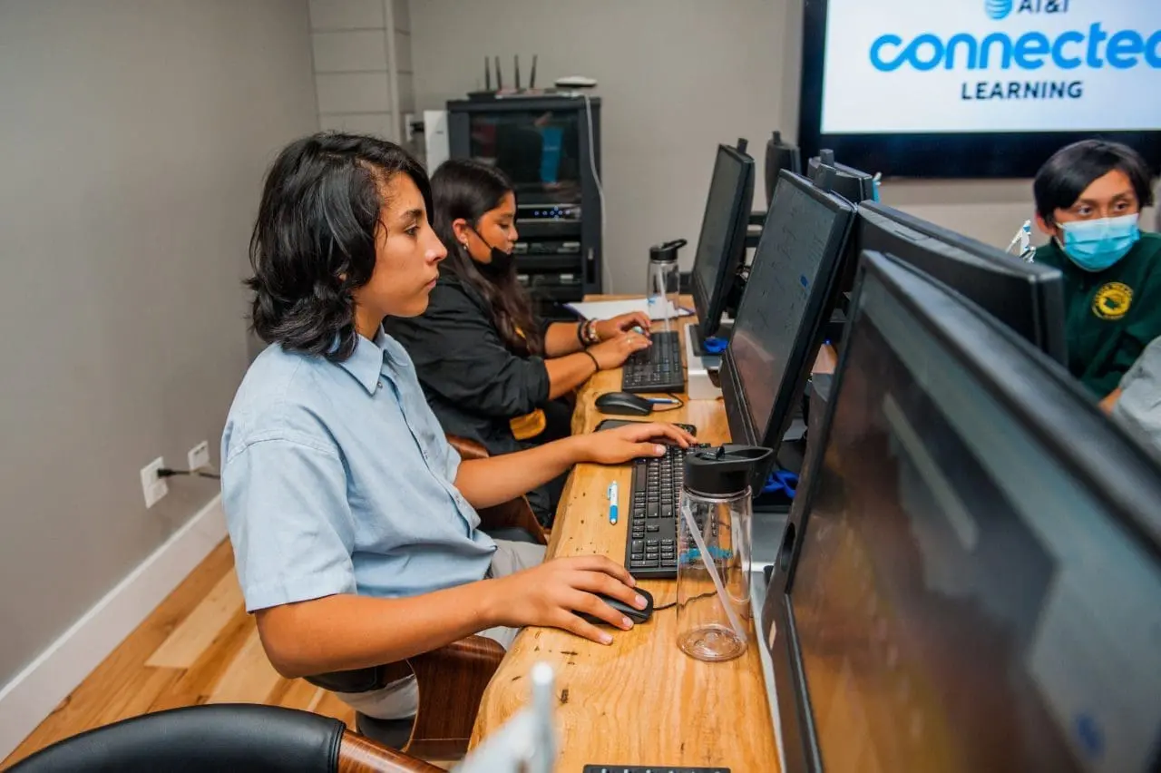 An image of people at a computer