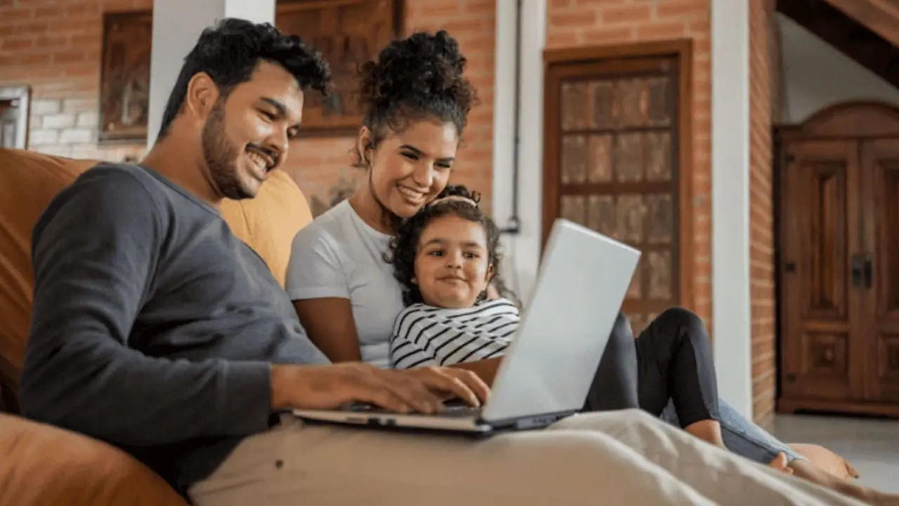 Family sitting with their laptop
