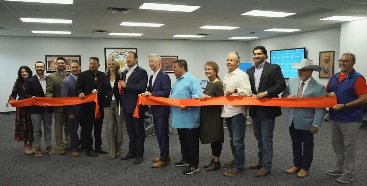 People at a ribbon cutting ceremony