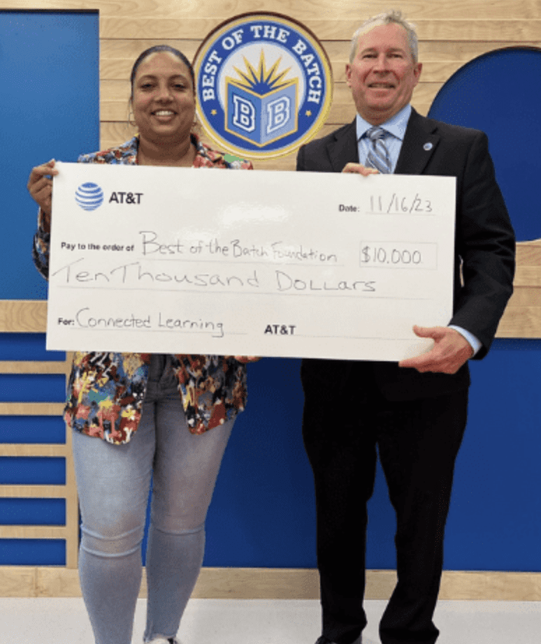 People holding a giant check