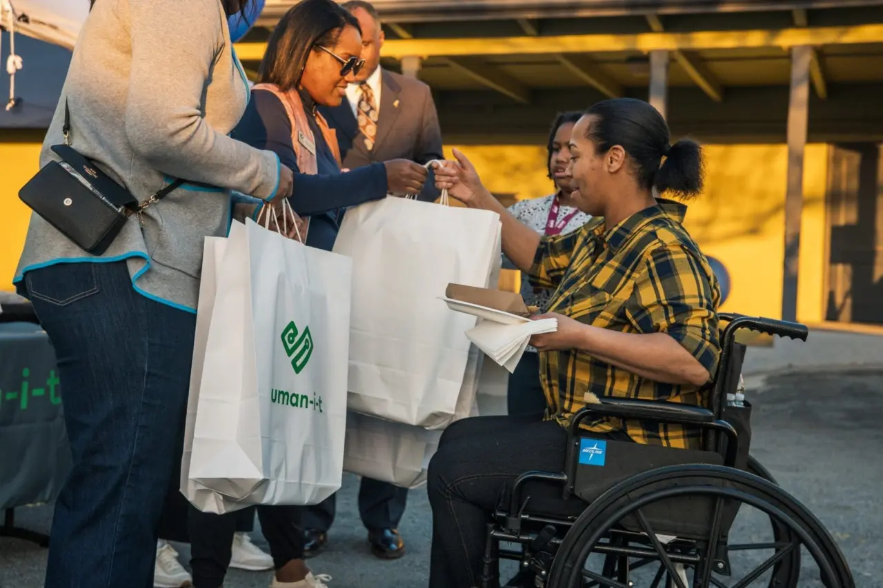 People receiving bags