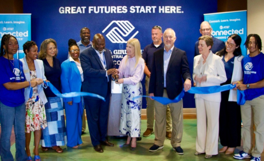 A group cutting a ribbon