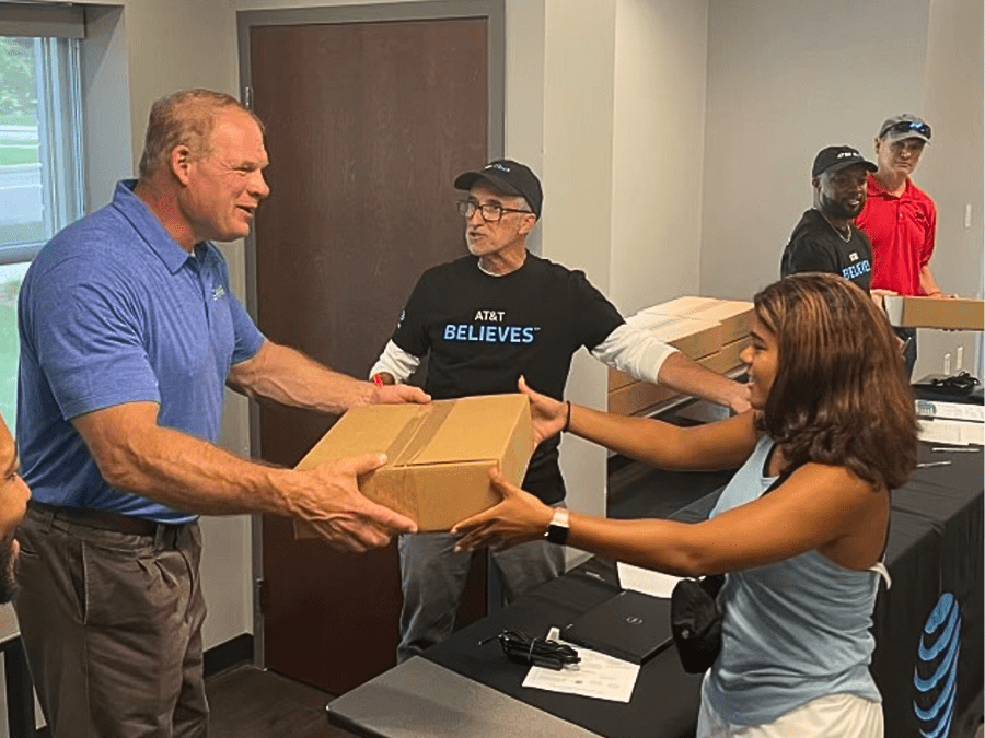 A person handing another person a box