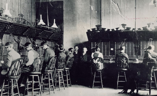People sitting at a switchboard