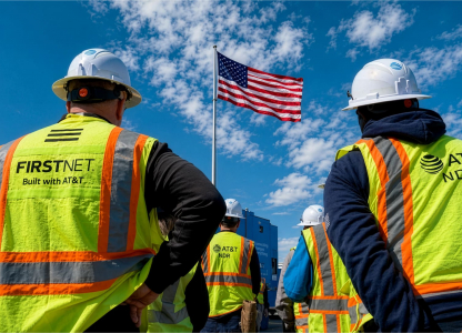 AT&T utility workers looking at American flag
