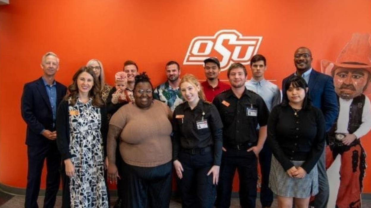Group in front of OSU wall