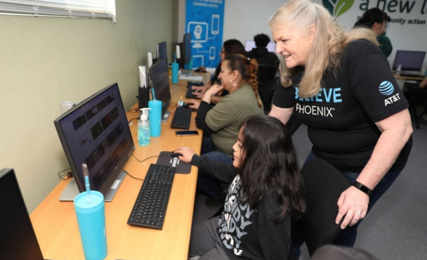 A woman and a child at a computer
