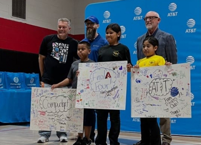 Kids smiling with posters