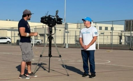 A man standing in front of a camera