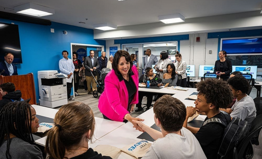 Mass. Lt. Governor Kim Driscoll shaking hands with someone.