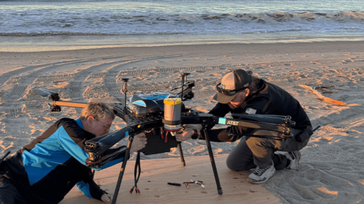 People setting up an AT&T drone