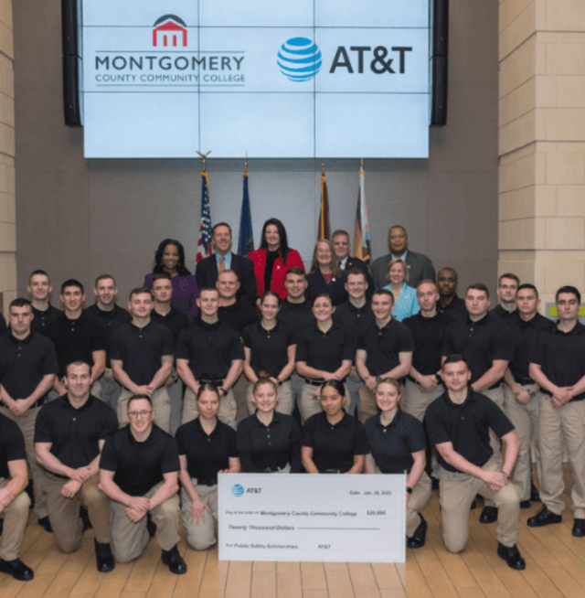 People with a giant check