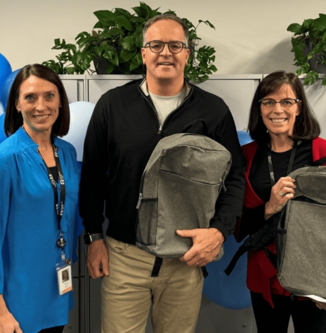 3 people standing in a line