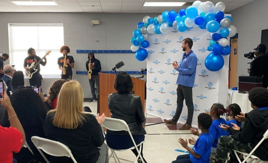 A group of people in a room watching a jazz band play