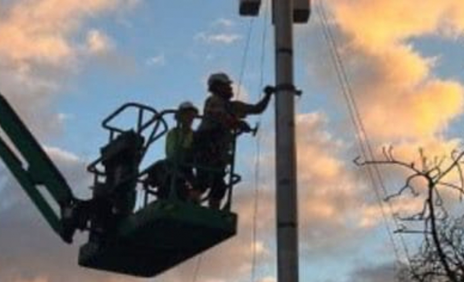 Workers working on a pole