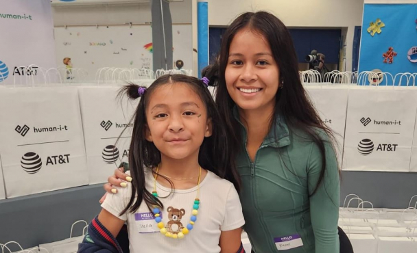 Woman and girl smiling at event