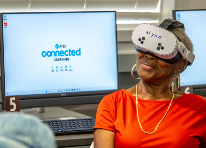An older woman wears a VR headset