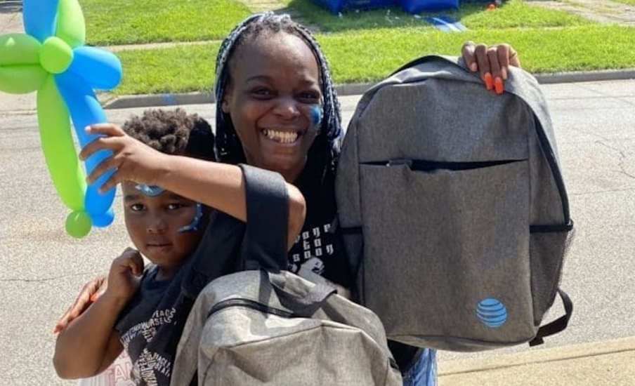 A child and woman with a backpack