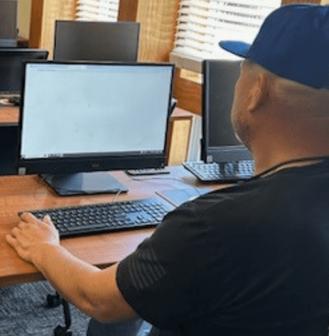 Man looking at a computer.