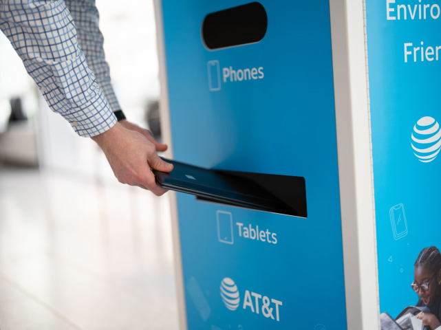 Person recycling their technology.