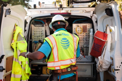 An AT&T employee standing at a truck