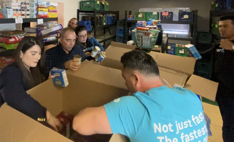 People unpacking boxes of food
