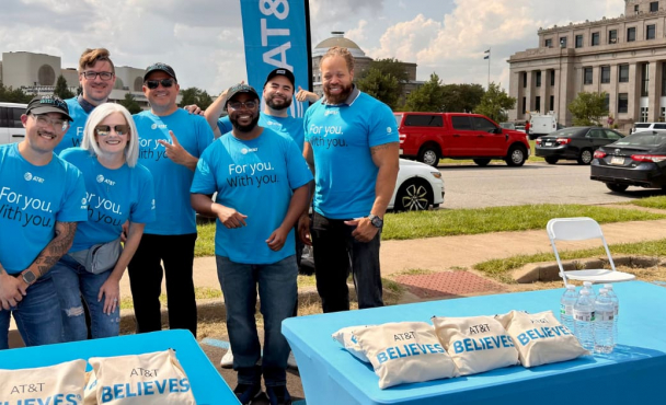 Group of volunteers smiling at event