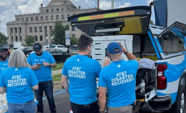 Group of volunteers gathered at truck