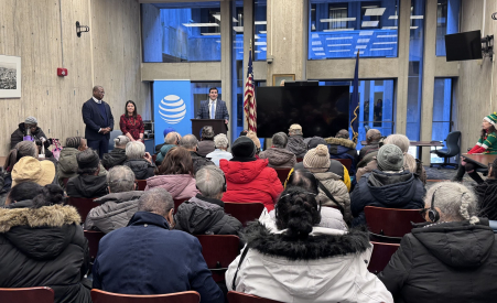 A person standing at a podium in front of a group of people