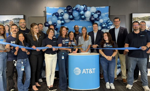 Group of people cutting ribbon at AT&T event