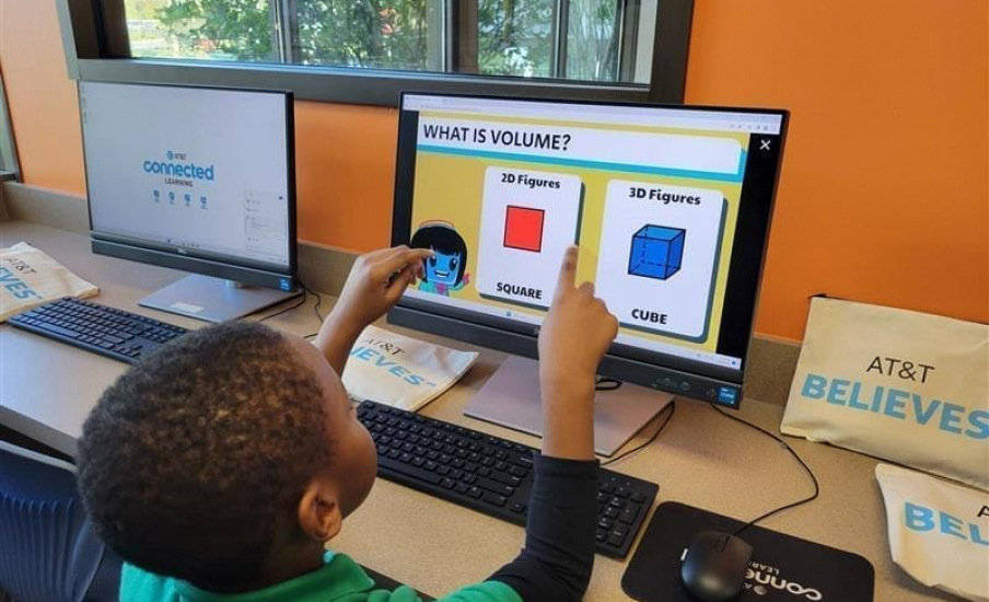 Children pointing at a computer screen