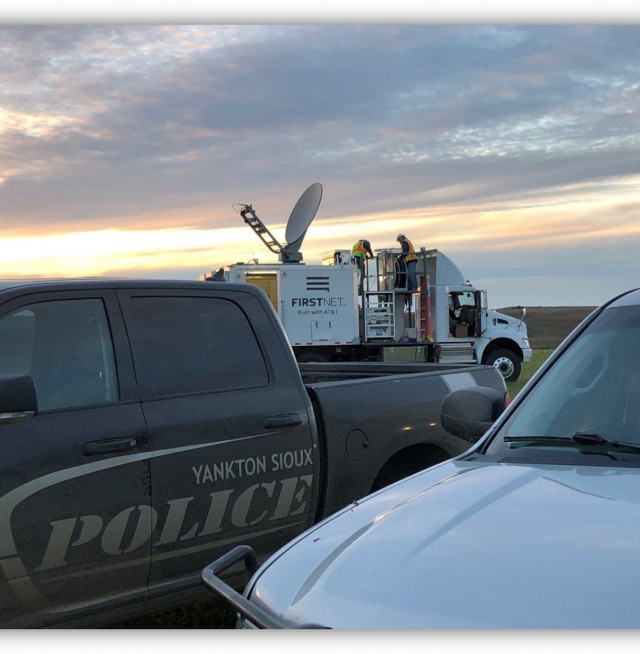 A FirstNet truck set behind a Yankton Sioux Police vehicle