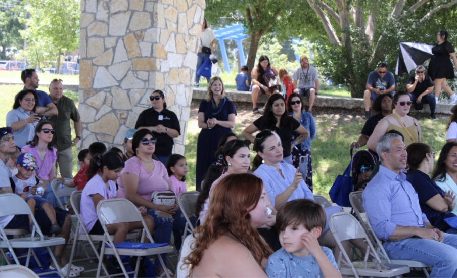 A group of people sitting in chairs