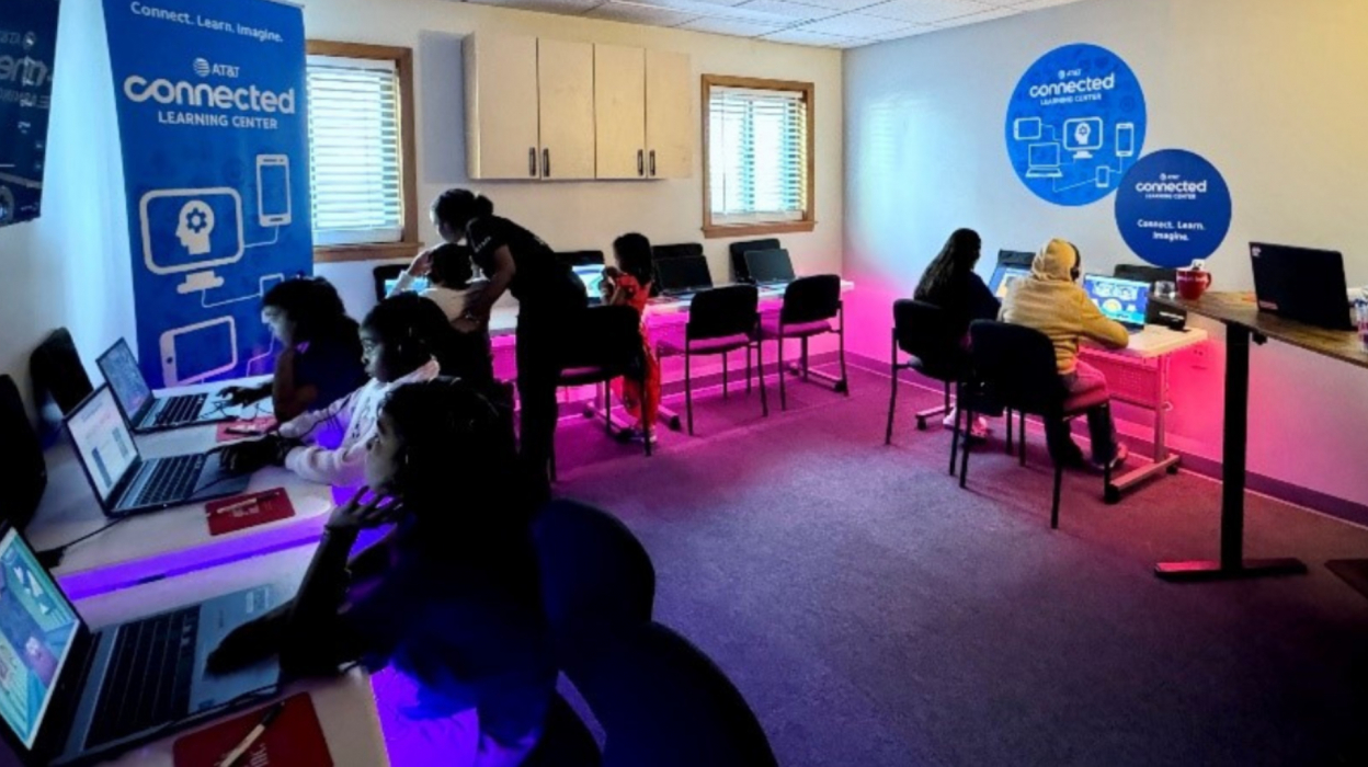 People sitting on computers at a connected learning center