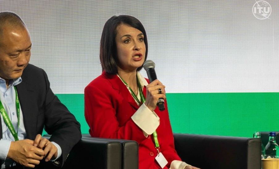 A woman speaking into a microphone