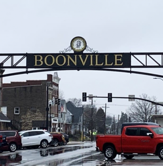 An over the road sign that reads "Boonville"