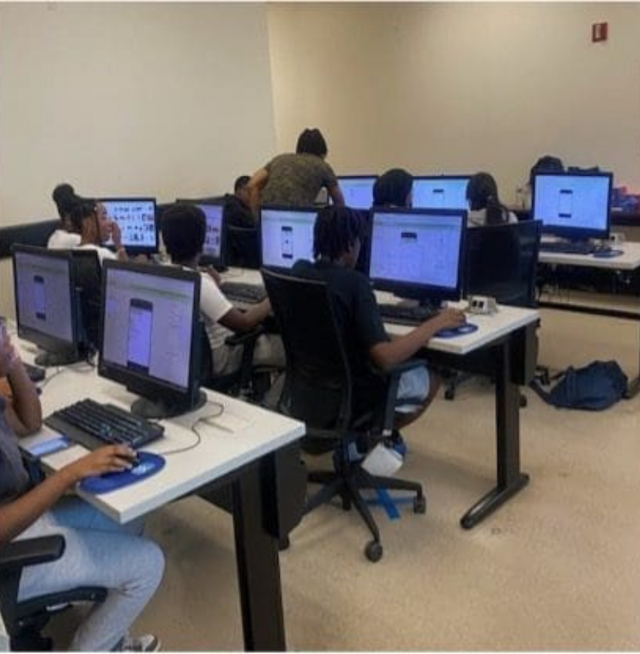 Kids sitting at computers in a computer lab