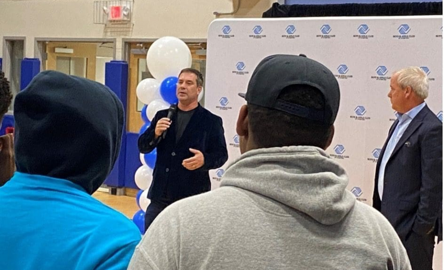 A man speaking to a crowd